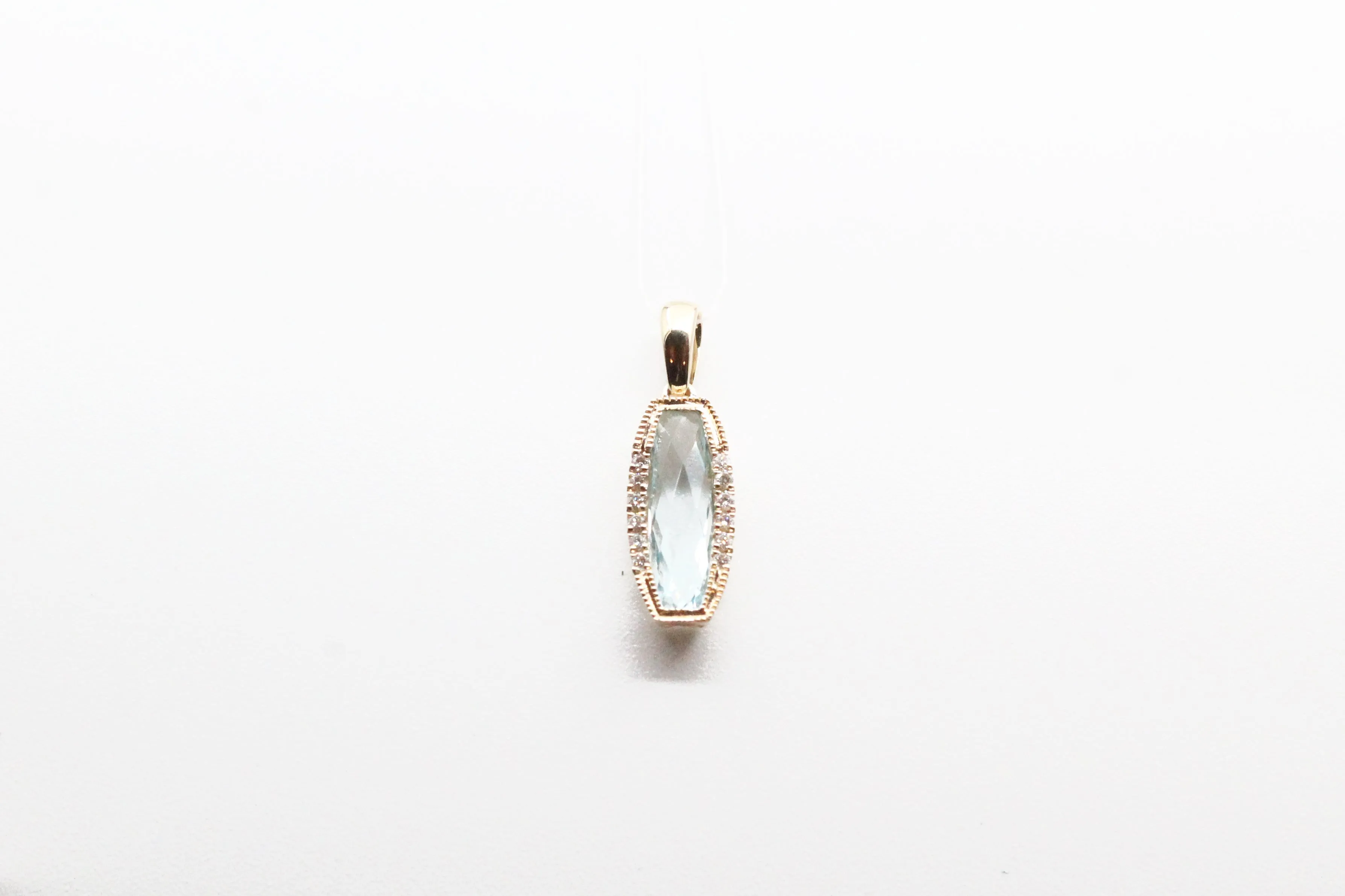 Yellow Gold Blue Topaz Milgrain Pendant